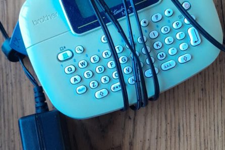 The Brother P-Touch PT-M95 is a compact, handheld label maker designed for quick and easy organization at home, school, or the office. It features a QWERTY keyboard and prints up to two lines of text on 9mm or 12mm non-laminated M-series tapes.